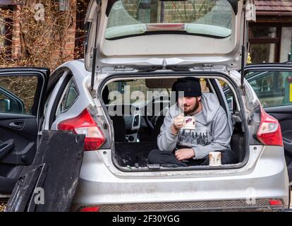 Time for a cuppa, taking a tea break in the back of a Ford Focus car, Alresford, Hampshire, UK Stock Photo