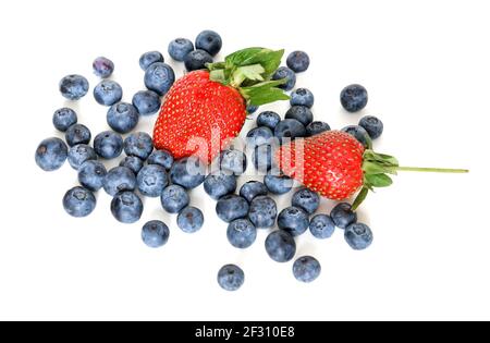 Two ripe juicy strawberries and garden blueberries on white background Stock Photo