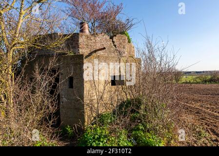 Wartime defence system on site of old RAF Chain Home radar station in Canewdon, Essex, UK. Gardiners Lane. Overgrown and decaying Stock Photo