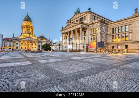 An empty Gendarmenmarkt square in Berlin just before sunrise Stock Photo