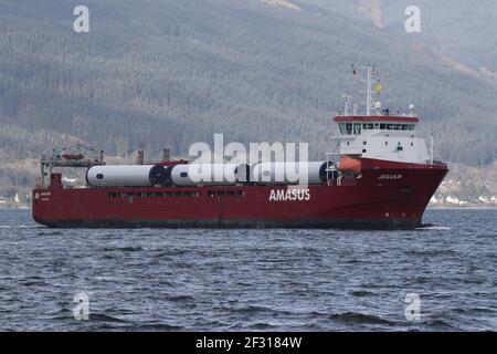 Jaguar, a general cargo vessel operated by Amasus Shipping, with a cargo of wind turbine parts, passing Kempock Point, Gourock, on the Firth of Clyde Stock Photo