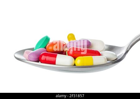 Spoon with pills Stock Photo