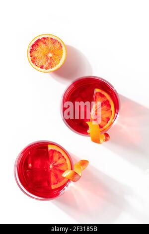 Cocktails with blood oranges, shot from the top on a white background Stock Photo