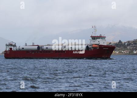 Jaguar, a general cargo vessel operated by Amasus Shipping, with a cargo of wind turbine parts, passing Kempock Point, Gourock, on the Firth of Clyde Stock Photo