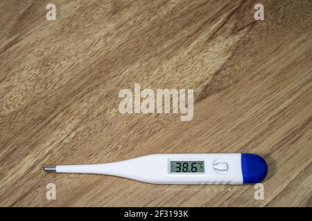 Digital thermometer indicating very high fever Stock Photo - Alamy