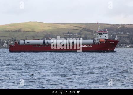 Jaguar, a general cargo vessel operated by Amasus Shipping, with a cargo of wind turbine parts, passing Kempock Point, Gourock, on the Firth of Clyde Stock Photo