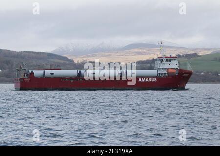 Jaguar, a general cargo vessel operated by Amasus Shipping, with a cargo of wind turbine parts, passing Kempock Point, Gourock, on the Firth of Clyde Stock Photo