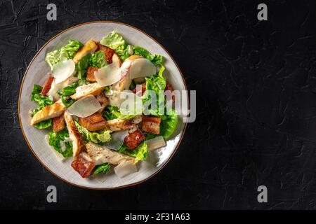 Caesar salad with chicken, shot from above with copy space Stock Photo