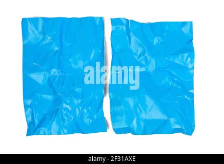 Crumpled blue cardboard sheet of paper isolated on white background Stock Photo