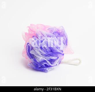 Multicolored plastic washcloth on a white background Stock Photo