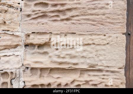 signs of erosion on a church wall, Santa Maria church, Talamanca, Catalonia, Spain Stock Photo