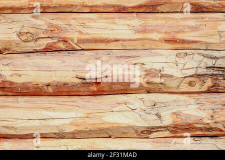 Log wall of a wooden hut as a background Stock Photo