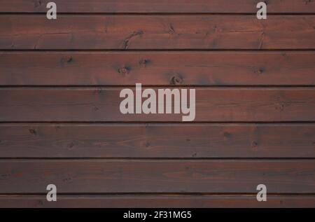 Wooden wall lined with dark plank as background Stock Photo