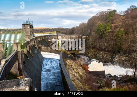 Water being released from the flood gates on Earlstound Dam, Galloway Hydro Electric Scheme, Scotland Stock Photo