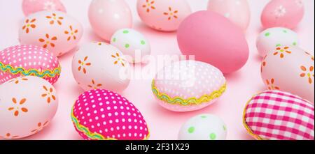 Easter eggs collection pink pastel color on pink background. Happy Easter greeting card, banner, Christian religion holiday celebration and decoration Stock Photo