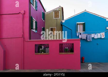 Italy, Venice, Burano, colourful houses with laundry hanging Stock Photo