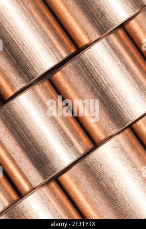 Copper alloy texture. Sleeve bronze bearings macro photo with selective focus, vertical industrial background Stock Photo
