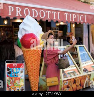 Italy,Venice,Burano, young Asian woman taking a selfie with a gelato Stock Photo