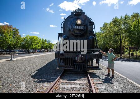 Senior man admiring the Union Pacific Big Boy Steam Locomotive X4012 in Scranton, PA Stock Photo