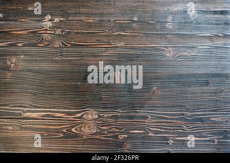 Dark brown black painted wooden desk background table texture empty horizontal surface. Stock Photo