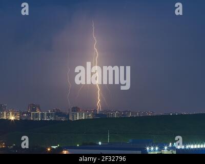 lightning over the city, city harbour at night, justice day, perfect storm Stock Photo