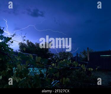 lightning over the city, city harbour at night, justice day, perfect storm Stock Photo