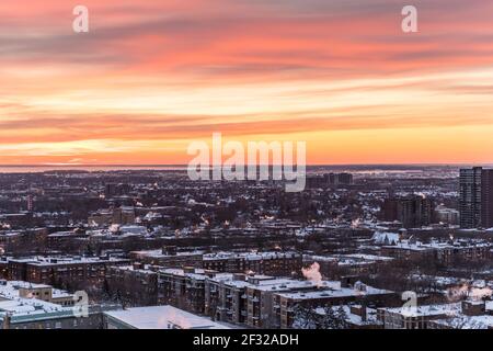 Dramatic sunset sky over the Western part of the island of Montreal in Winter, Montreal, Qc, Stock Photo