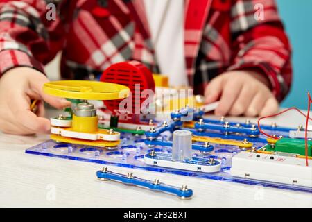 children playing with electronic constructor at studio Stock Photo