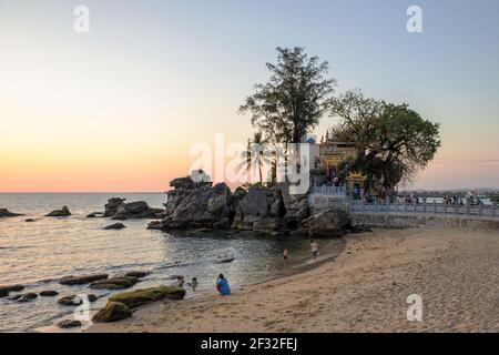 Tourists visiting the temple and lighthouse of Dinh Cau on the Phu Quoc island, Vietnam Stock Photo