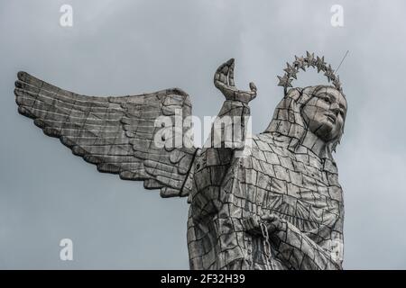 Virgin Mary de Quito Statue with a set of angel wings atop a dome-shaped hill called El Panecillo, Ecuador Stock Photo