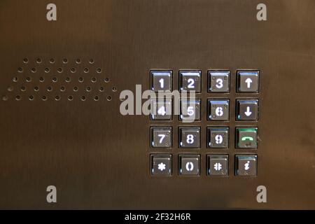 key pad for entering numbers or calling up to a unit or entering password with an audio speaker Stock Photo