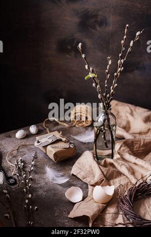 Spring's still life with bouquet and gift decorated of willow branches. Easter concept Stock Photo