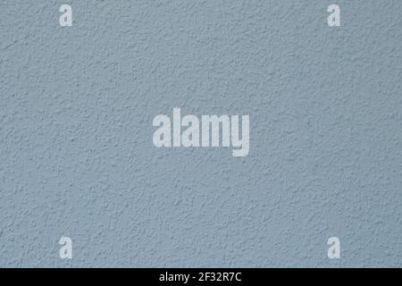 Wall painted with gotele texture in pale blue. Roughness called gotele that looks like small droplets on the wall Stock Photo