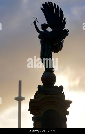 The Peace Statue of 1912 on the Brighton Hove boundary. Brighton and Hove, England. The i360 tower in the background. Stock Photo