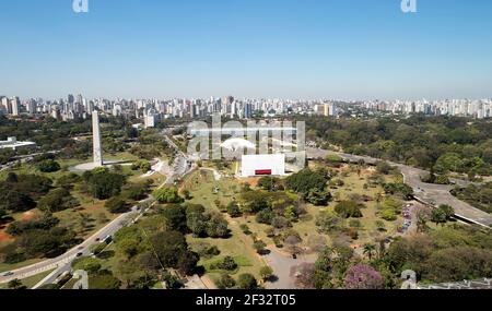 Aerial view of Ibirapuera park in Sao Paulo city, obelisk monument. Prevervetion area with trees and green area of Ibirapuera park. Office buildings a Stock Photo