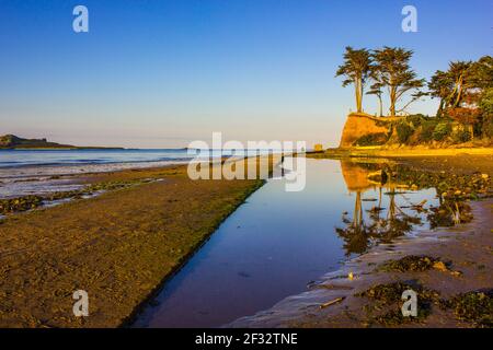 Reflection in Howth Beach at Sunset Stock Photo