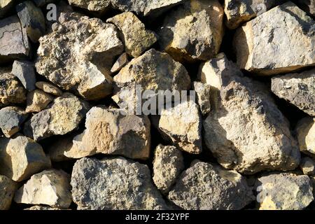 Beige natural stones wall as background Stock Photo