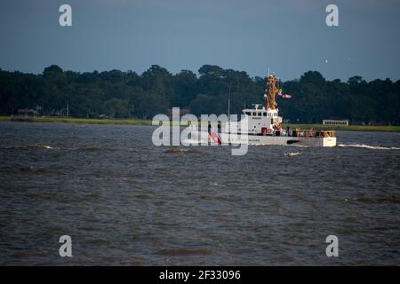 A US Coast Guard boat patrolling the Charleston Harbor Stock Photo