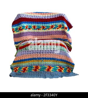 A vintage colorful broomstick stitch lace crochet blanket draped over a chair created by American textile artist Margaret Braaten (1914-2004). Stock Photo