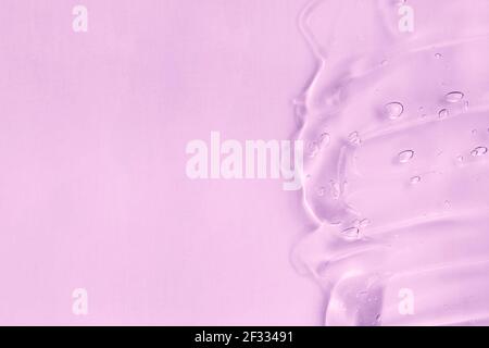 Cosmetic cream transparent purple liquid gel sample swatch. Hyaluronic acid for skin care with collagen and retinol. Pink gel smudge isolated on Stock Photo