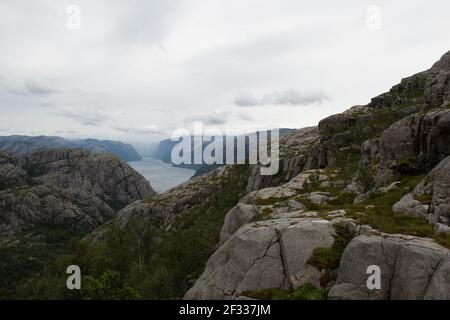 panorama from Preikestolen cliff in norway with the fjord and steep rocks Stock Photo