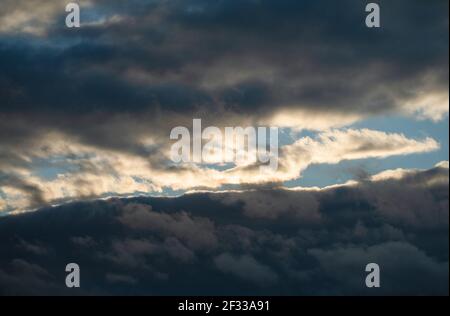Dramatic colorful sky, during sunset. Huge clouds formations. Stock Photo