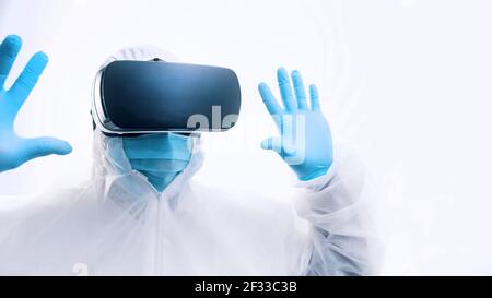 Doctor using VR glasses to prepare for the surgery. Monitoring patient simulation. High quality photo Stock Photo