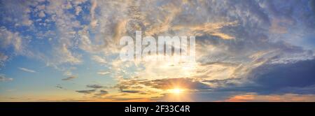 Panorama of dramatic colorful sky at sunset Stock Photo