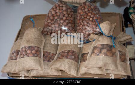 Ripe unshelled hazelnuts  as nut  background in package bags Stock Photo