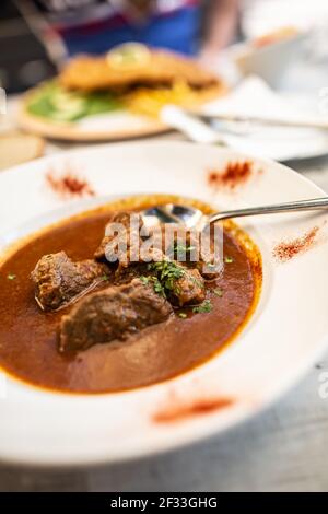 Beef or veal goulash served in a plate with juice stew, served in a plate. Stock Photo