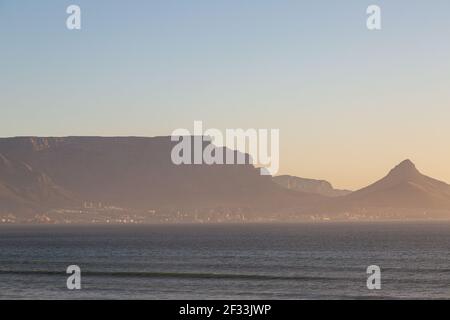 Look onto the Table Mountain in early evening sun seen from Bloubergstrand in Cape Town, Western Cape of South Africa Stock Photo