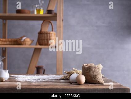 Bakery ingredients for homemade bread cooking or baking on table. Food set at wooden tabletop near wall background texture with copy space. Front view Stock Photo