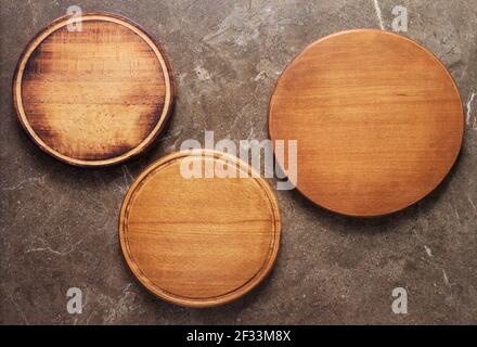 Pizza or bread cutting board for homemade baking on table. Food recipe concept at stone background texture with copy space. Flat lay top view Stock Photo