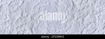 Panoramic snow surface with light drifts in closeup Stock Photo